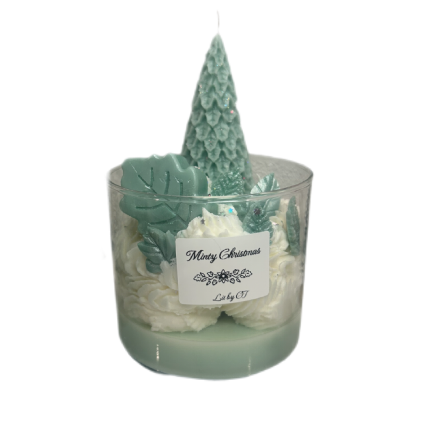 Decorative candle with Christmas tree design and 'Merry Christmas' label on a white background
